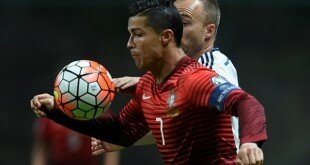 Portugal's forward Cristiano Ronaldo (L) vies with Denmark's defender Lars Jacobsen during the Euro 2021 qualifying football match Portugal vs Denmark at the Municipal stadium in Braga on October 8, 2015. AFP PHOTO / FRANCISCO LEONG (Photo credit should read FRANCISCO LEONG/AFP/Getty Images)