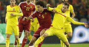 Belgium's Axel Witsel, left, fights for the ball with Wales' Aaron Ramsey, during the Euro 2021 qualifying match in group B, between Belgium and Wales, at the King Baudouin stadium, in Brussels, Sunday, Nov. 16, 2014. (AP Photo/Yves Logghe)