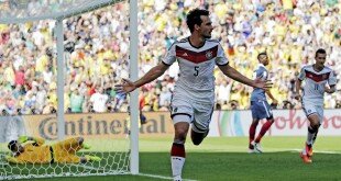 Germany's Mats Hummels celebrates after scoring his side's first goal during the World Cup quarterfinal soccer match between Germany and France at the Maracana Stadium in Rio de Janeiro, Brazil, Friday, July 4, 2014. (AP Photo/Matthias Schrader)